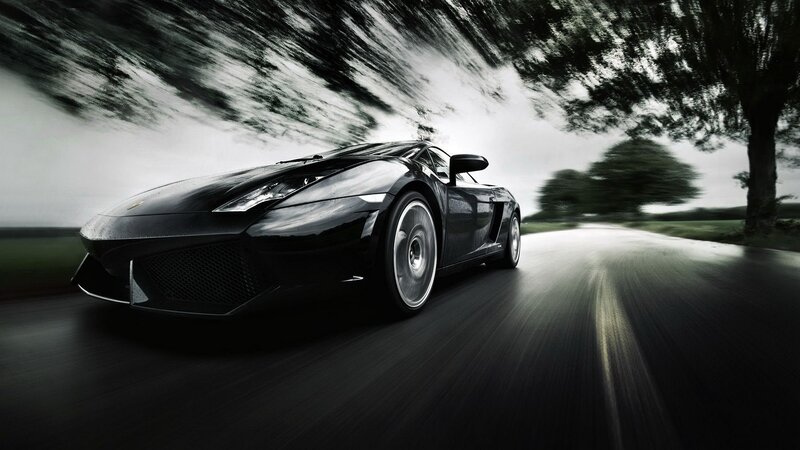 Black sports car on a country road