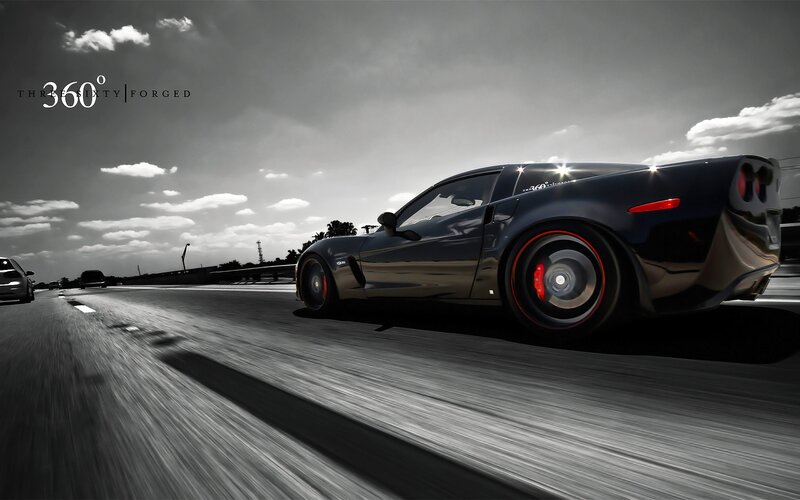 Black sports car on a highway