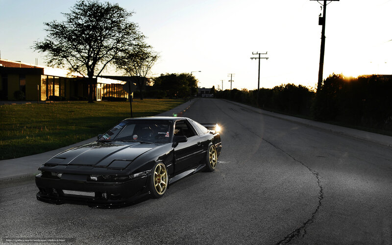 Black sports car on a quiet street