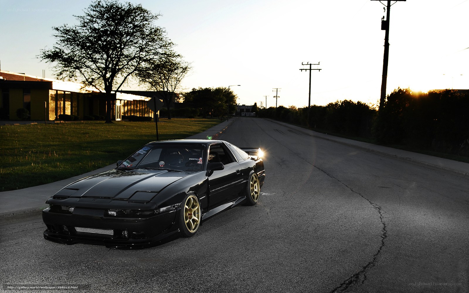 Black sports car on a quiet street