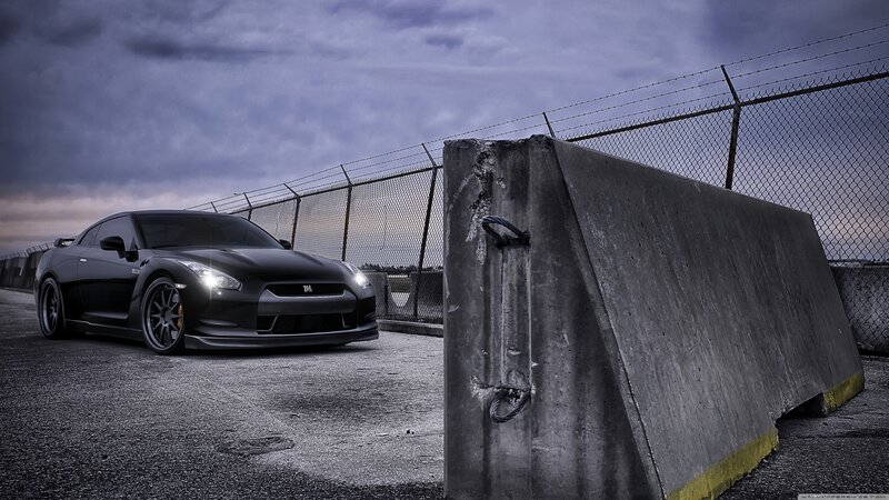 Black sports car on a racetrack