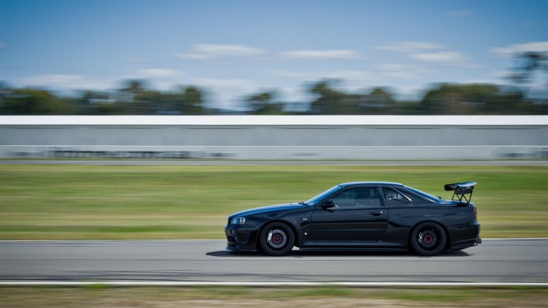 Black sports car on a racetrack