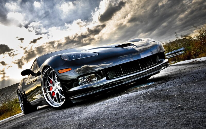 Black sports car on a road