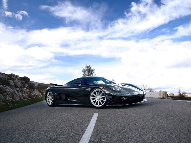 Black sports car on a road