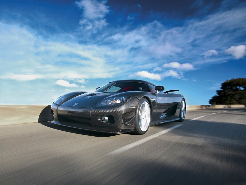 Black sports car on a road