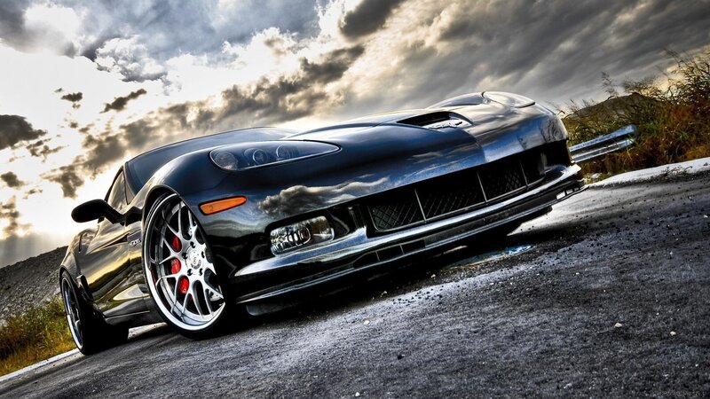 Black sports car on a road
