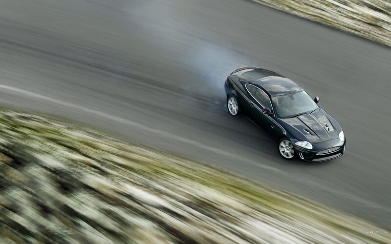 Black sports car on a road