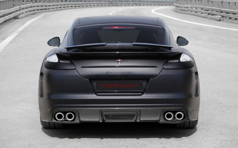 black sports car on a road