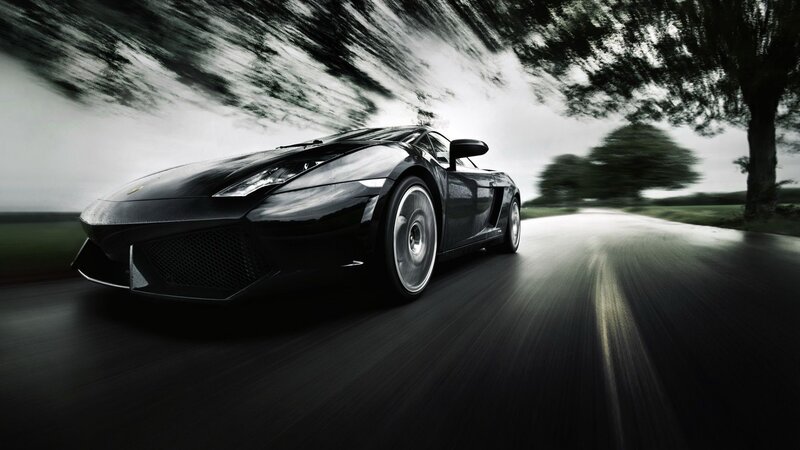 Black sports car on a road