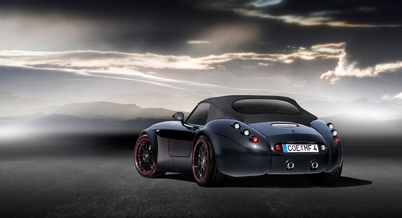 Black sports car on a road