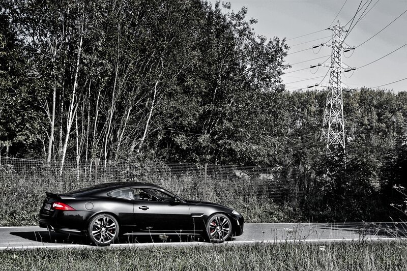 Black sports car on a road
