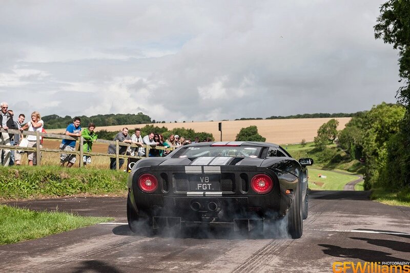 Black sports car on a road
