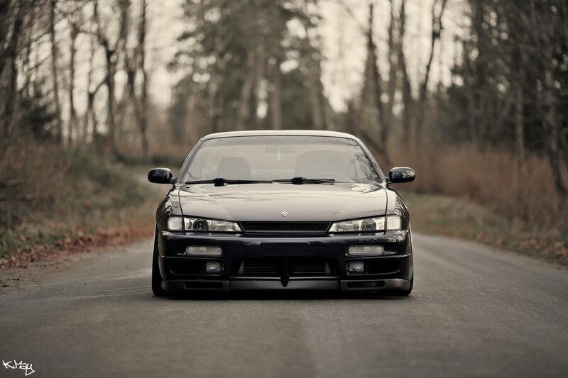 black sports car on a road