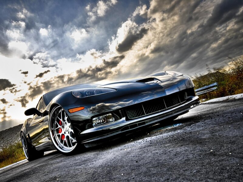 Black sports car on a road