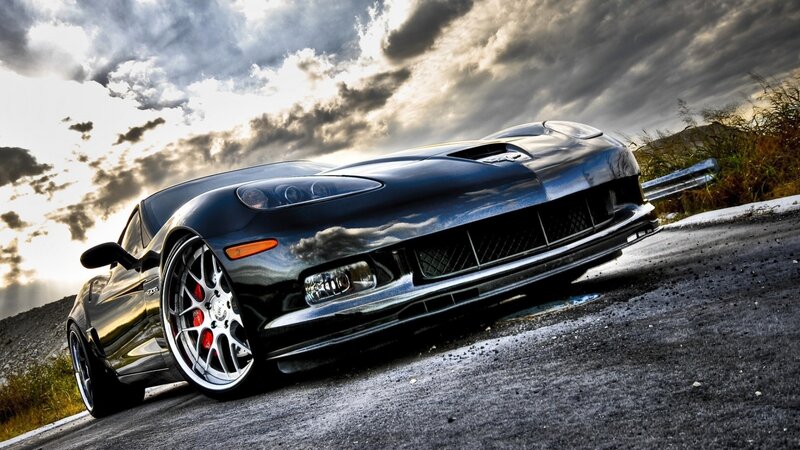 Black sports car on a road