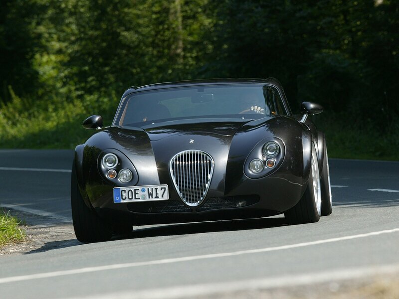 Black sports car on a road