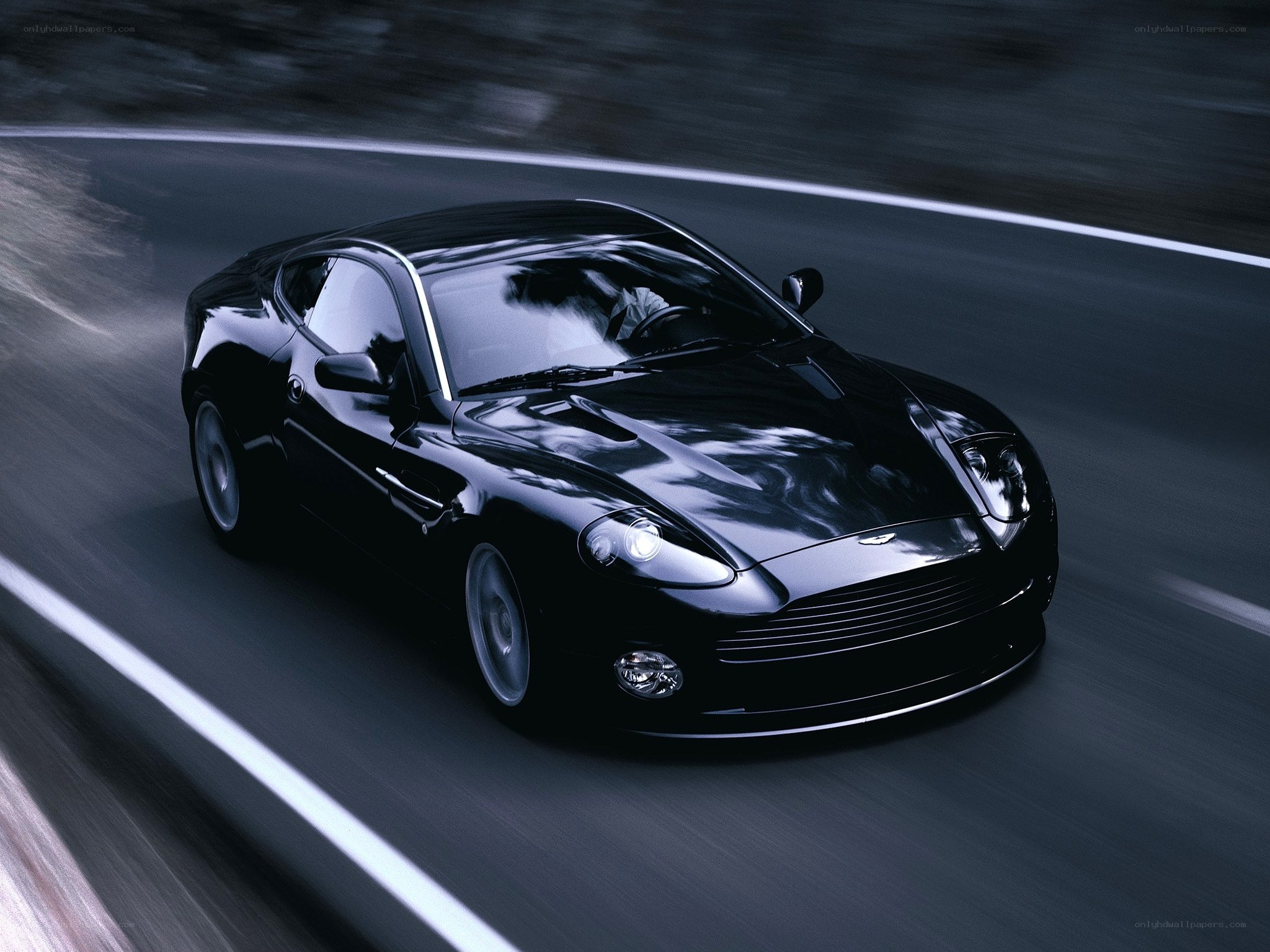 Black sports car on a road