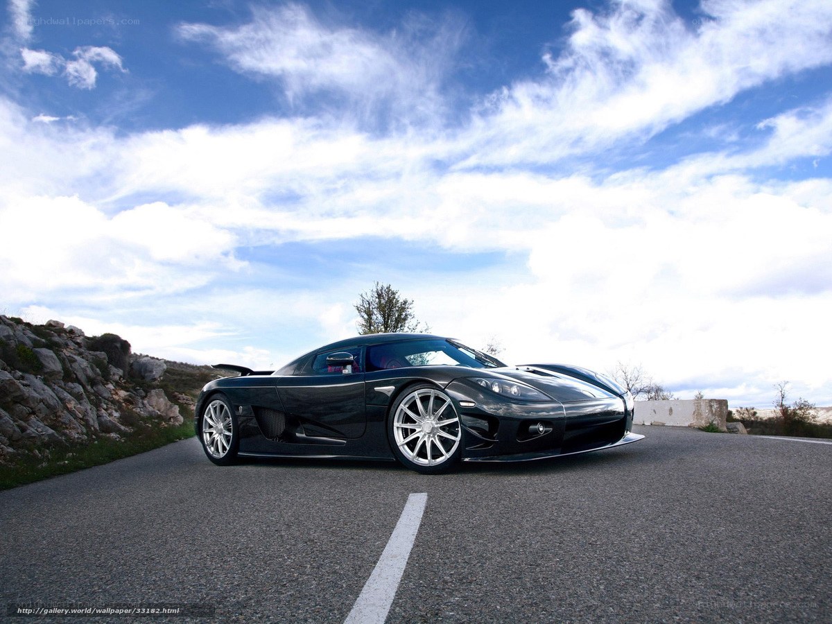 Black sports car on a road