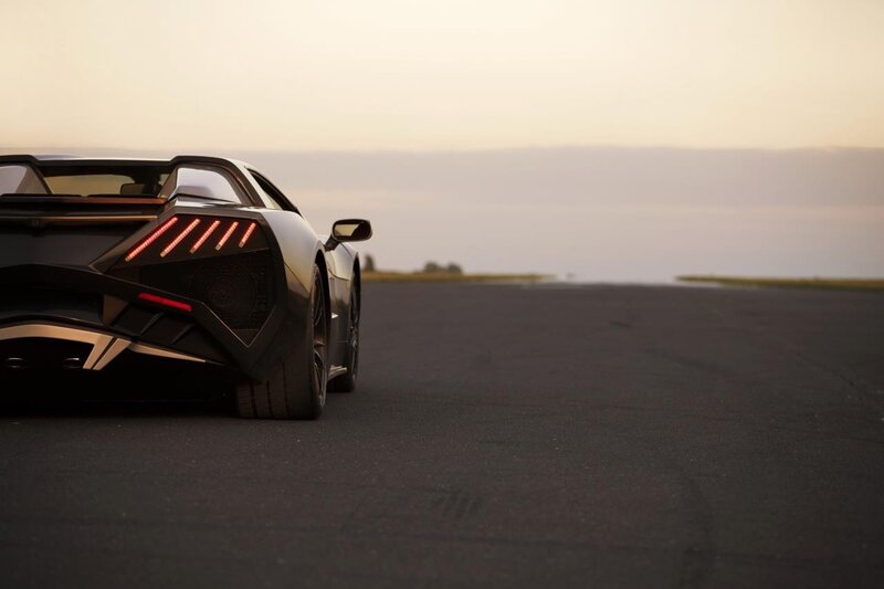 Black sports car on a runway