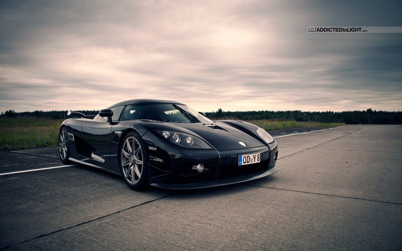 Black sports car on a runway