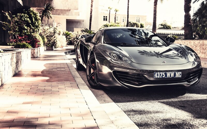 Black sports car on a sunny street