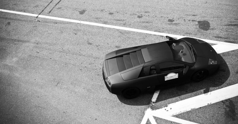 Black sports car on asphalt