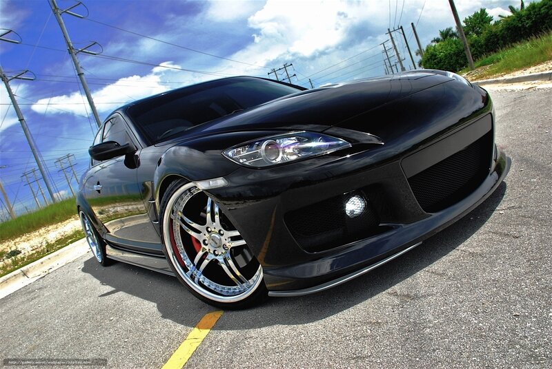 black sports car on asphalt
