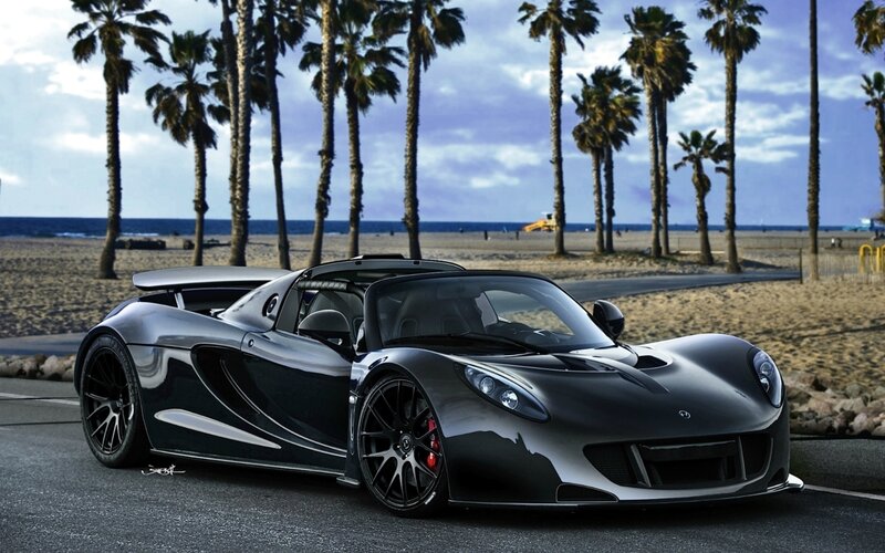 Black Sports Car on Beach — Dramatic