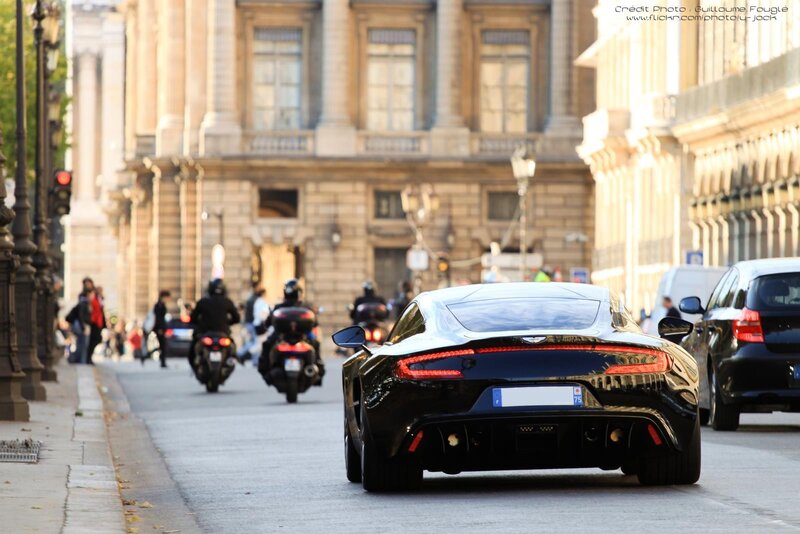 Black sports car on city street