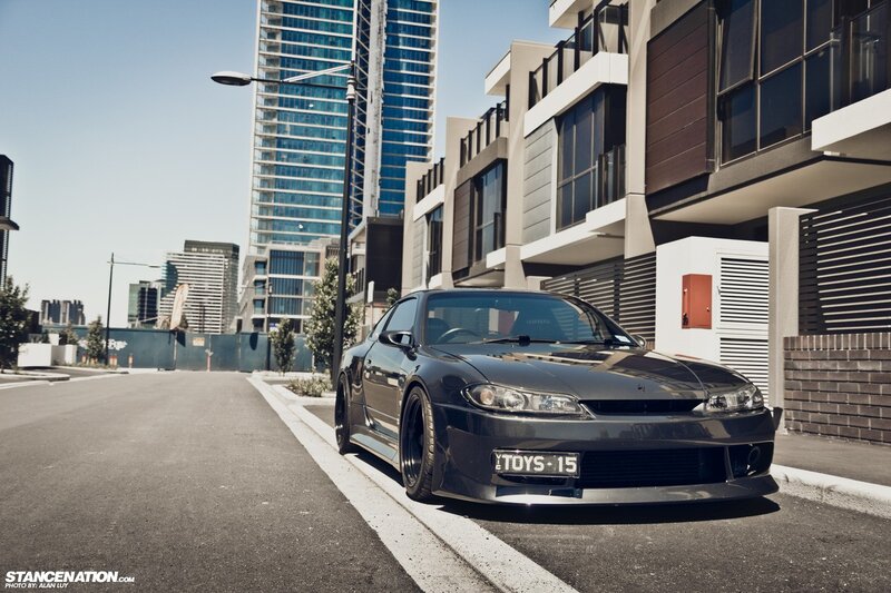 Black sports car on city street