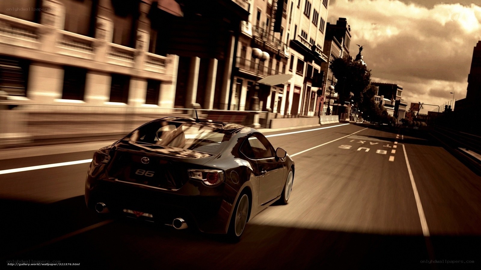 Black sports car on city street