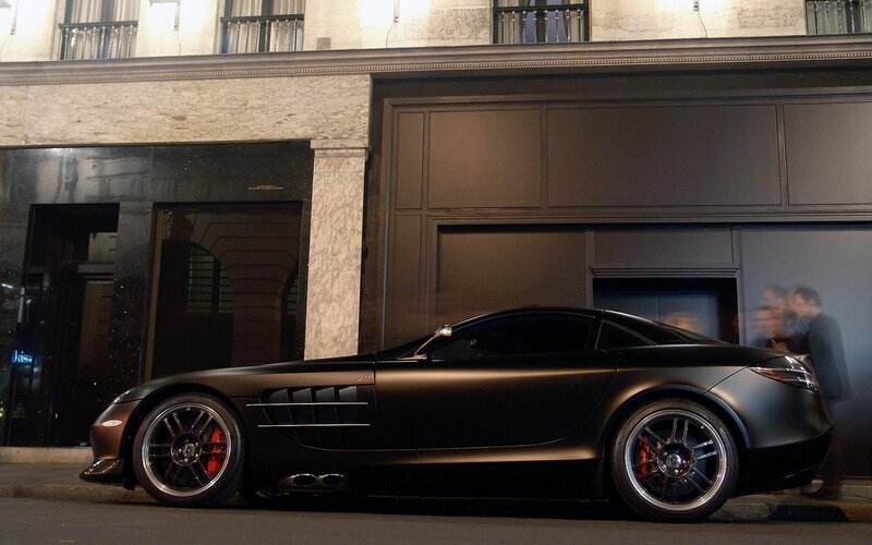 Black sports car on city street