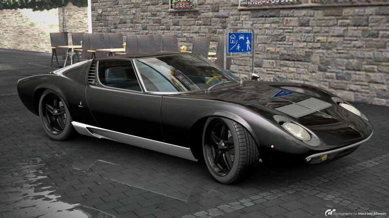black sports car on cobblestone