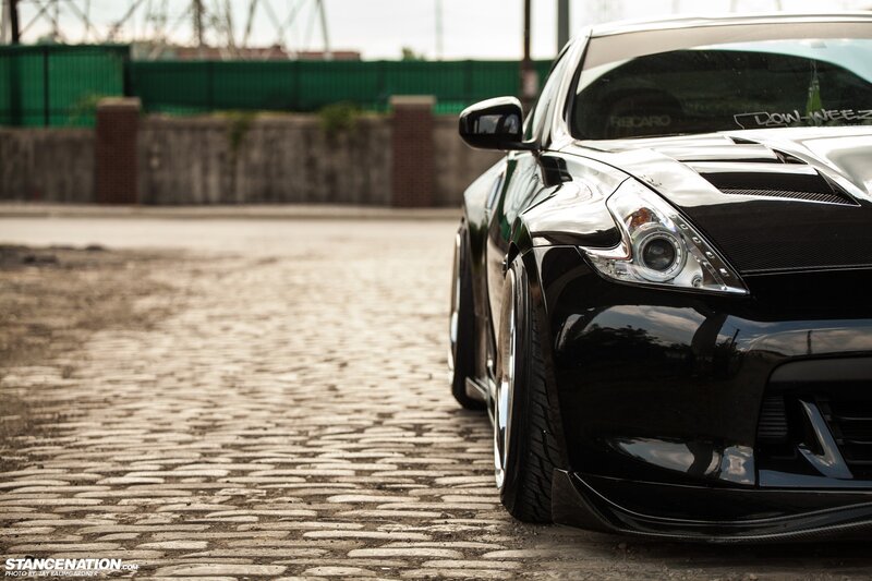 black sports car on cobblestones