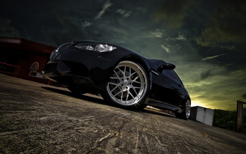Black sports car on concrete