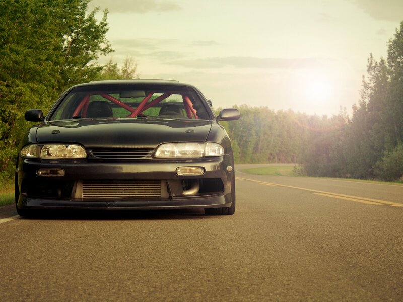 black sports car on country road