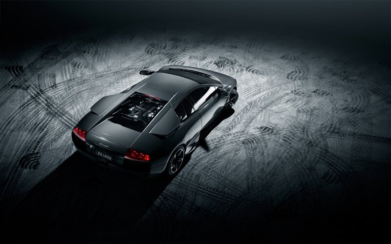 black sports car on dark surface