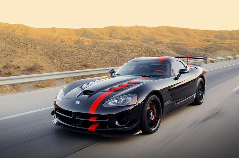 Black sports car on desert road