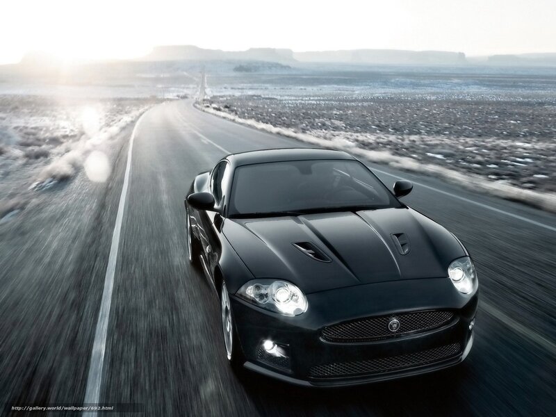 Black sports car on desert road