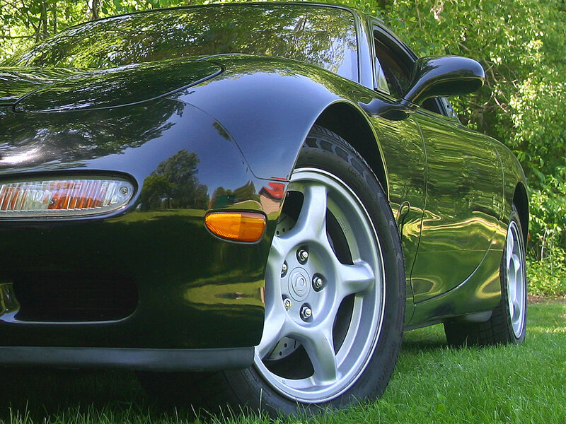 black sports car on grass