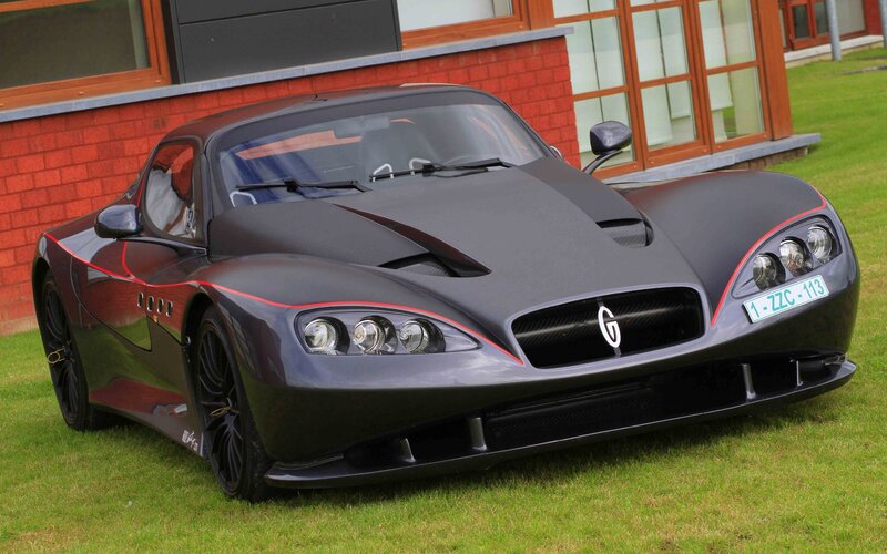 black sports car on grass
