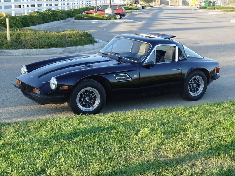 Black sports car on grass