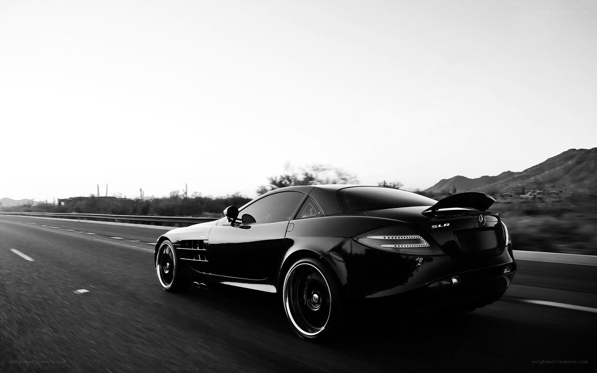 Black sports car on highway