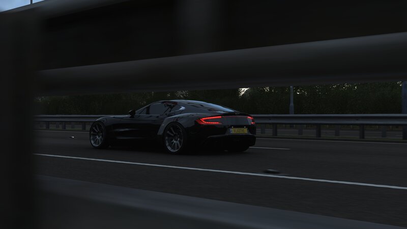 Black Sports Car on Highway — Dark