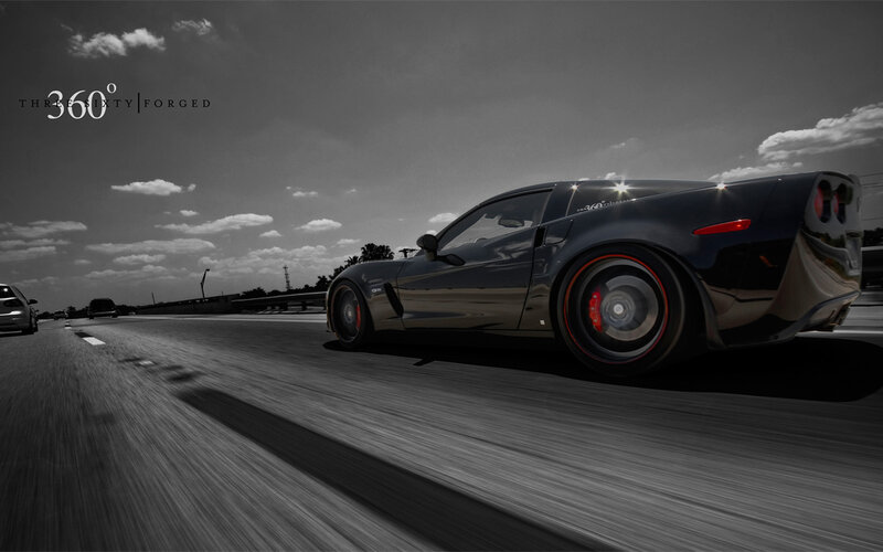 Black Sports Car on Highway — Dramatic