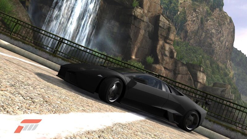 Black sports car on mountain road