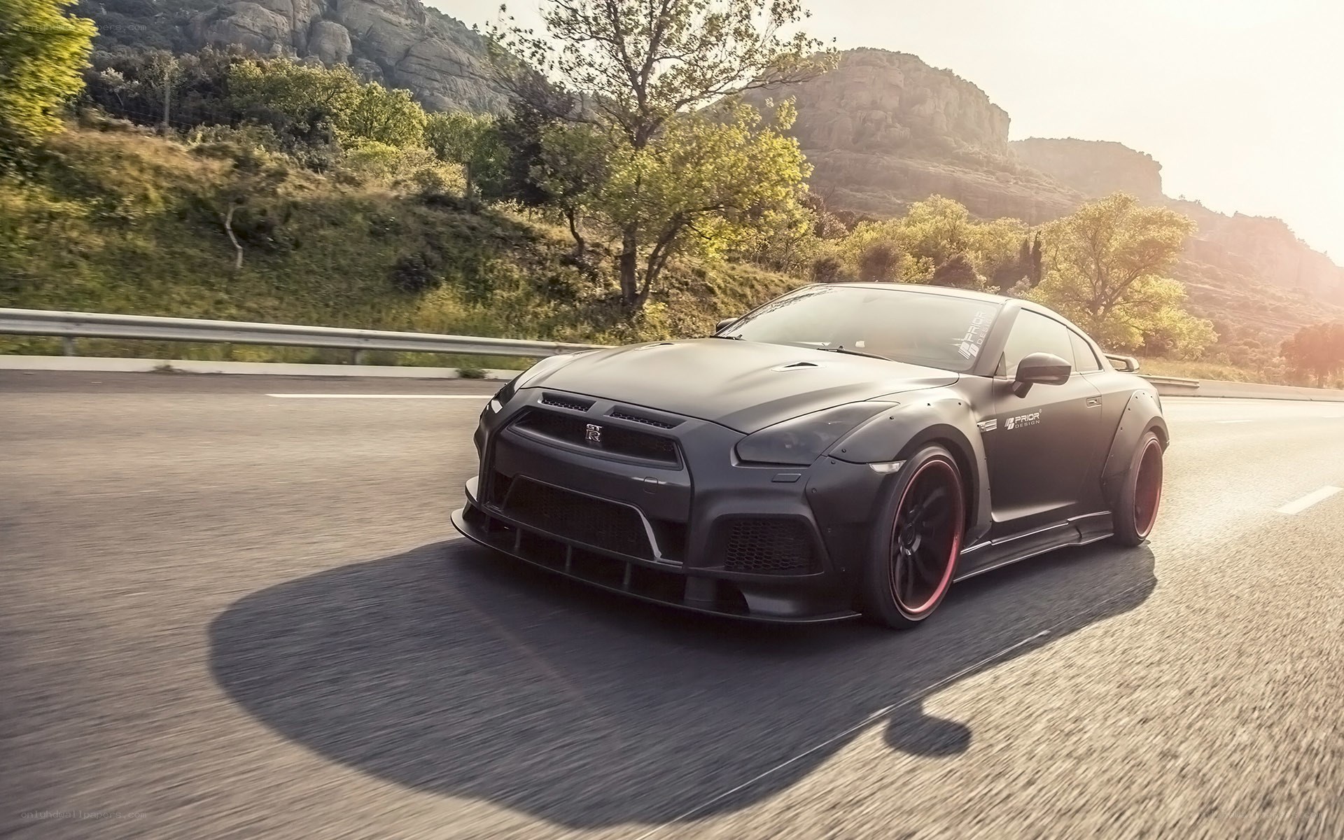 black sports car on mountain road