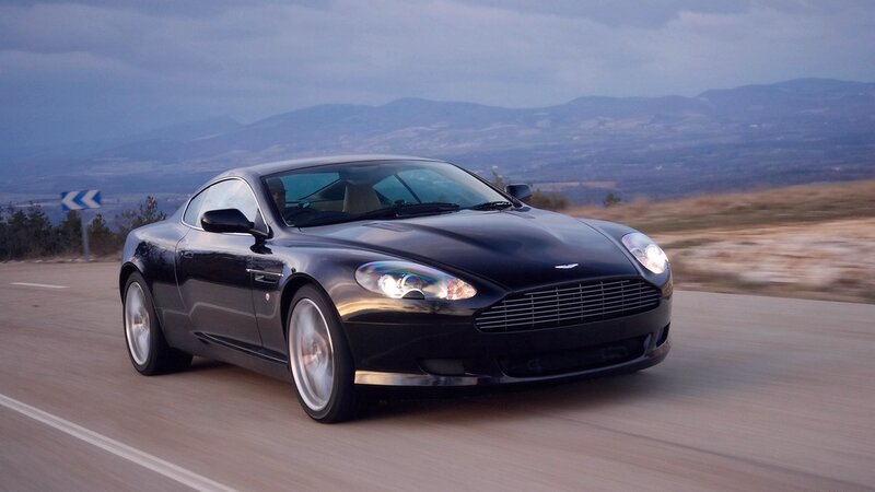 black sports car on mountain road