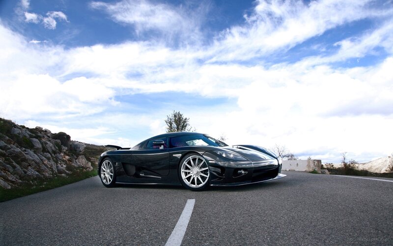 black sports car on mountain road