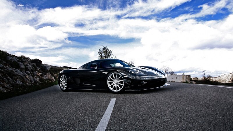 black sports car on mountain road